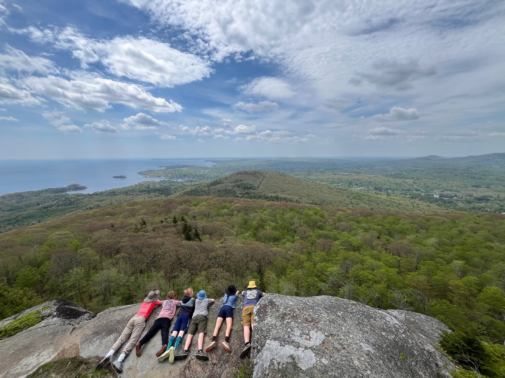 This is the month of spring overnight trips at Brightfield! As a part of our school year, our students take part in overnights and expeditions that progress in challenge and skill as they get older. We just welcomed back our 3/4 cohort from a cabin on a pond in Bridgton, our 5/6 cohort from two nights in a cabin at Camden Hills State Park, and our 7/8 students are currently backpacking for four nights in the White Mountains on the Pemi loop.
Experiential education is a part of daily life at Brightfield, but our expeditions are a chance for students to really stretch their sense of self, and what they can achieve as a group. We are proud of all the risks they took on, the joys they discovered, and the peak experiences they are having at the end of this school year.