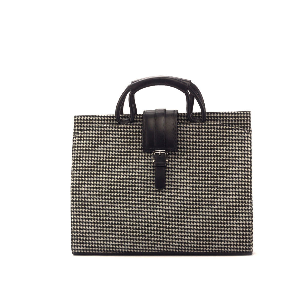 The Houndstooth Sartorial Black Leather Briefcase blends sleek black leather with classic houndstooth fabric. Handcrafted in Spain, it’s perfectly sized at 13 x 16.5 x 2 inches to carry your laptop, documents, and daily essentials—making it a stylish yet practical choice for modern professionals.